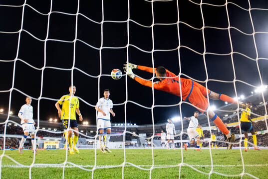 Gustaf Lagerbielke of Sweden and goalkeeper Arijanet Muric