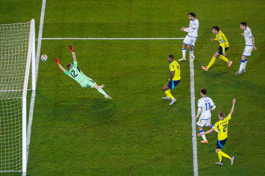 Leon Avdullahu of Kosovo shoots the ball in the goal post