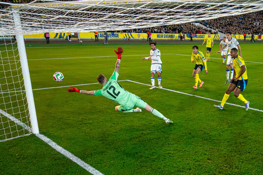 Leon Avdullahu of Kosovo shoots the ball in the goal post