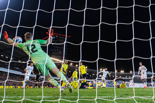 Goalkeeper Viktor Johansson of Sweden reaches for the ball