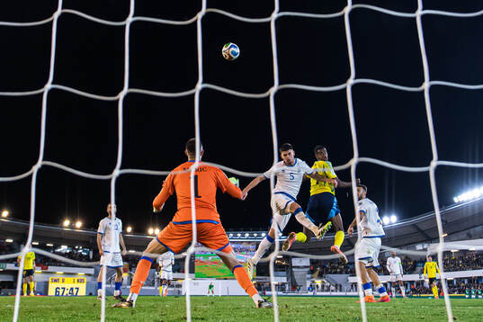 Goalkeeper Arijanet Muric and Albian Hajdari of Kosovo are