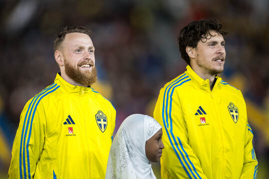 Goalkeeper Viktor Johansson and Victor Nilsson Lindelöf of