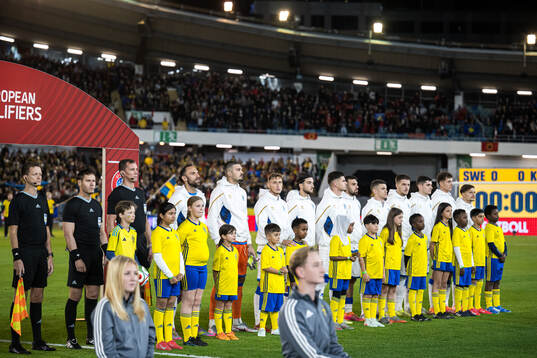 Mascots in front of the Kosovo players