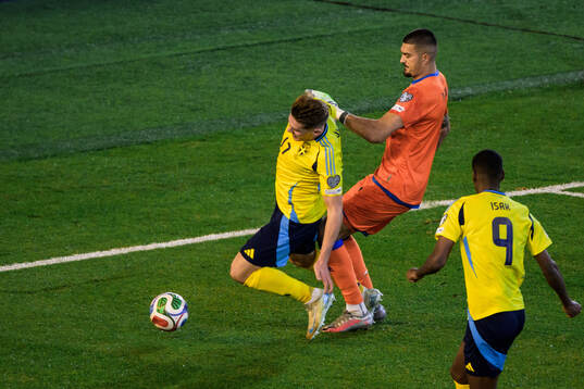 Viktor Gyökeres of Sweden and goalkeeper Arijanet Muric of