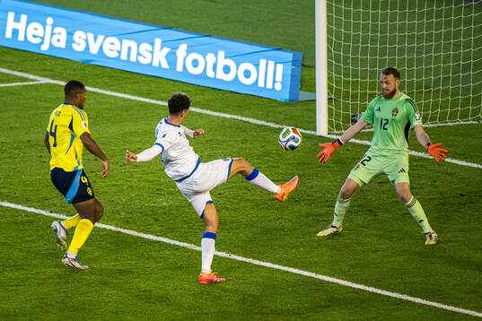 Fisnik Asllani of Kosovo scores the 0-1 goal behind Isak