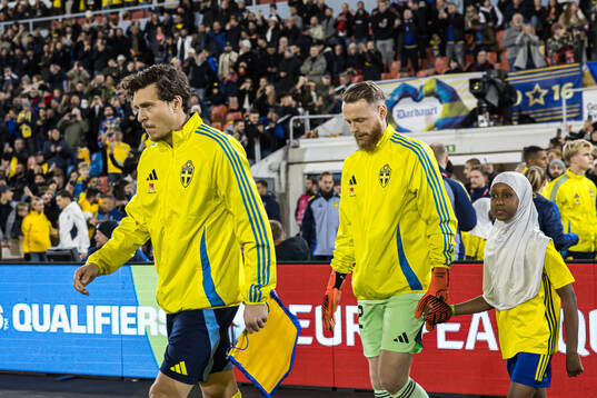 Victor Nilsson Lindelöf and goalkeeper Viktor Johansson of