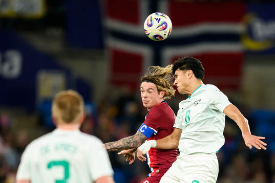 Patrick Berg of Norway and Marko Stamenic of New Zealand