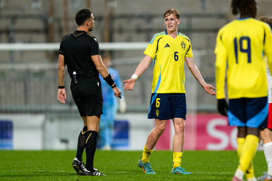 Referee Oguzhan Çakir and Olle Samuelsson of Sweden