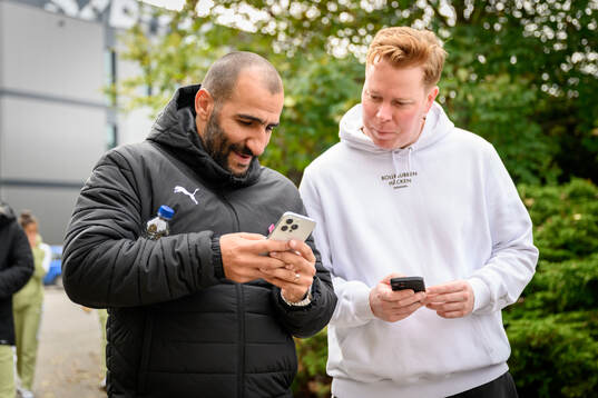 Coach Mak Lind and kit manager Fredrik Arnberg participate