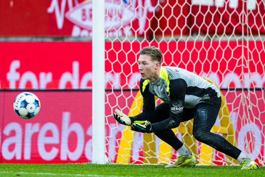 Goalkeeper Mathias Dyngeland of Brann warms up