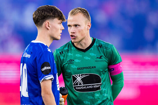 Almar Gjerd Grindhaug and goalkeeper Amund Wichne of