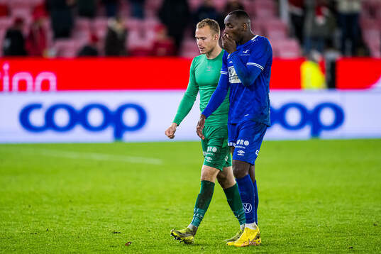 Goalkeeper Amund Wichne and Parfait Bizoza of Haugesund