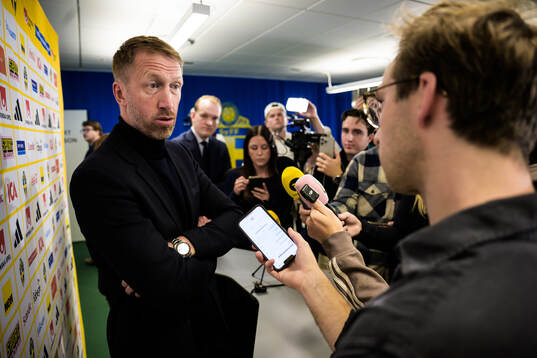 Graham Potter is being interviewed by media