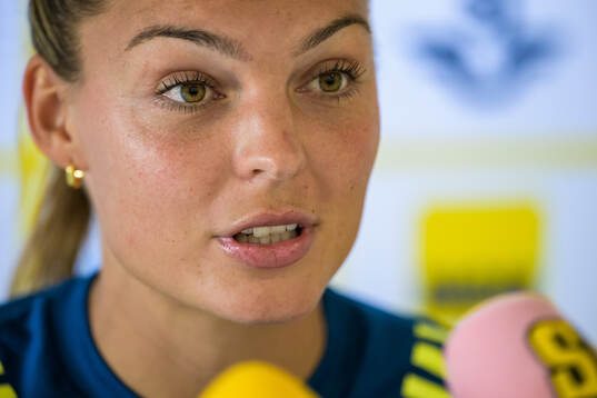 Johanna Rytting Kaneryd is interviewed by the media at a