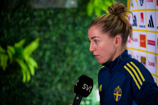 Linda Sembrant is interviewed by the media at a press event