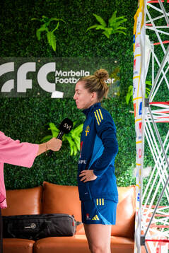 Linda Sembrant is interviewed by the media at a press event