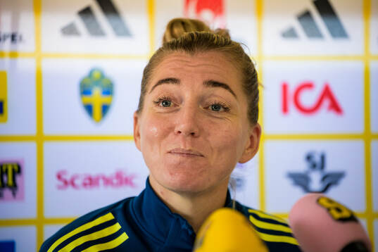 Linda Sembrant is interviewed by the media at a press event