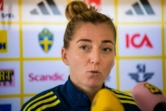 Linda Sembrant is interviewed by the media at a press event