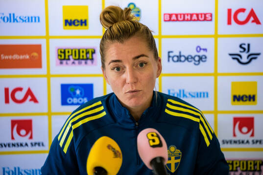 Linda Sembrant is interviewed by the media at a press event