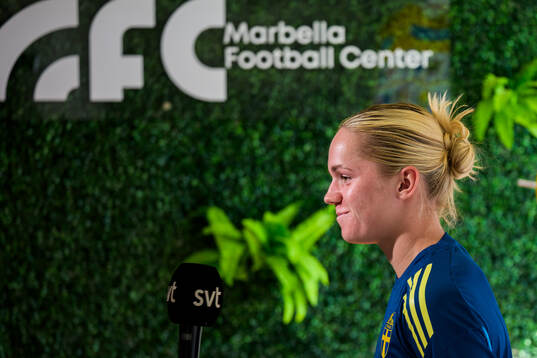 Hanna Lundkvist is interviewed by the media at a press