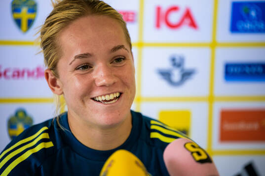 Hanna Lundkvist is interviewed by the media at a press