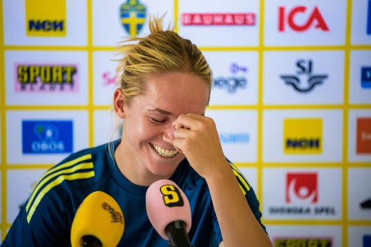 Hanna Lundkvist is interviewed by the media at a press