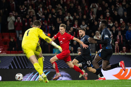 Emil Kornvig of Brann scores 1-0 behind goalkeeper Jack