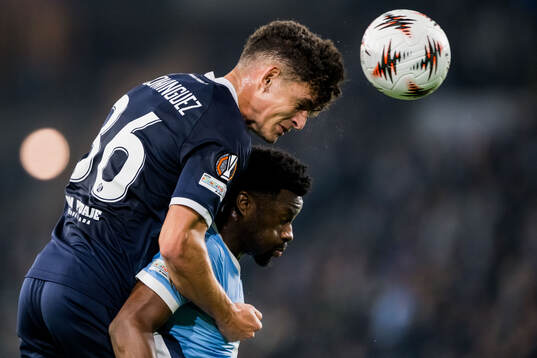 Sergi Dominguez of Dinamo Zagreb and Emmanuel Ekong of