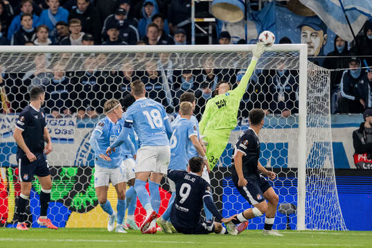 Dion Beljo of Dinamo Zagreb and goalkeeper Melker Ellborg