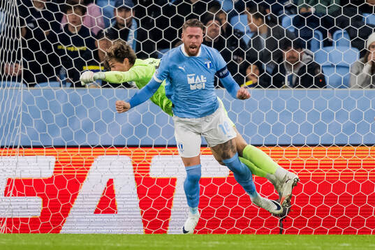 Goalkeeper Melker Ellborg and Pontus Jansson of Malmö FF