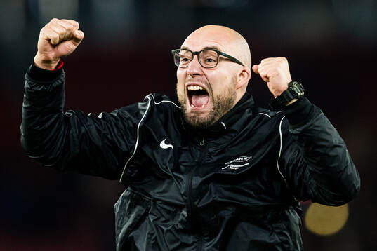 Assistent coach Jonathan Hartmann of Brann celebrates
