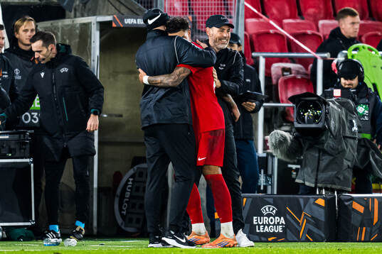 Noah Jean Holm of Brann and head coach Freyr Alexandersson