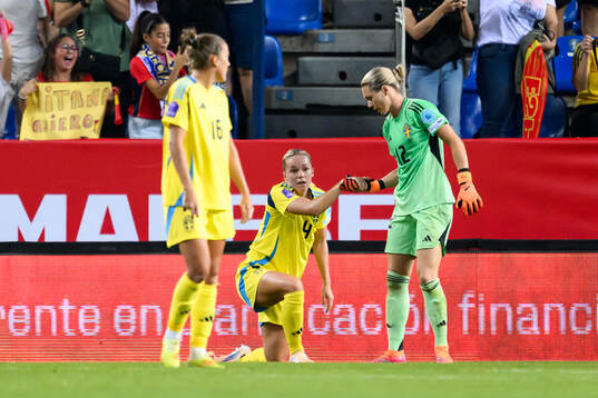 Hanna Lundkvist and goalkeeper Jennifer Falk of Sweden