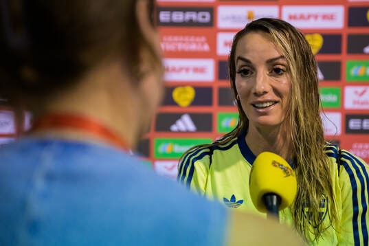 Kosovare Asllani of Sweden is interviewed by media