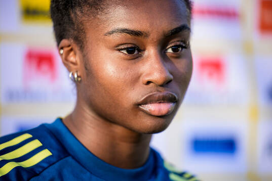 Monica Jusu Bah is being interviewed by the media of the