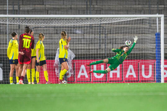 Larissa Muhlhaus of Germany scores 0-1 behind goalkeeper