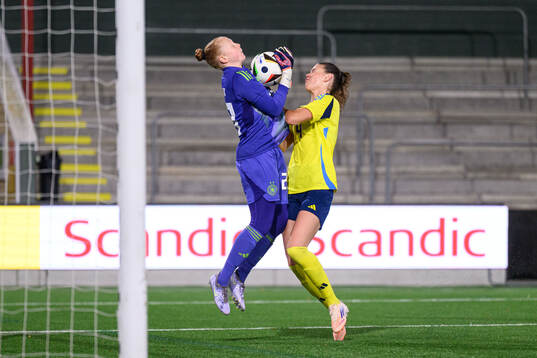 goalkeeper Thea Farwick of Germany and Bella Andersson of