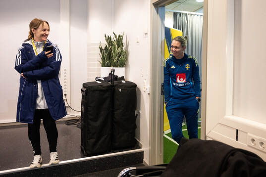 Press officer Lisa Eskils and goalkeeper Jennifer Falk of