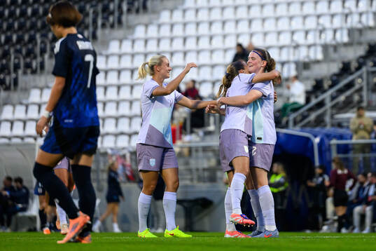 Signe Gaupset and Guro Reiten of Norway celebrate