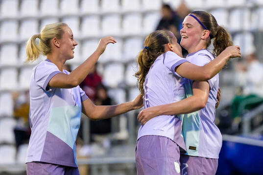 Lisa Naalsund and Guro Reiten celebrate with Signe Gaupset