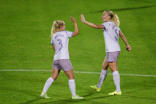Emilie Woldvik and Guro Bergsvand of Norway celebrate