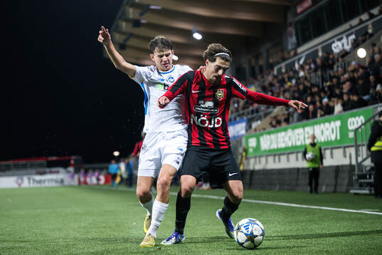 Pavlo Liusin of Dynamo Kyiv and Leart Krasniqi of