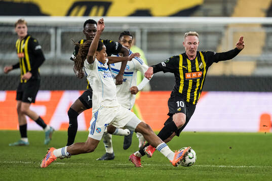 Mathis Amougou of Strasbourg and Mikkel Rygaard Jensen of