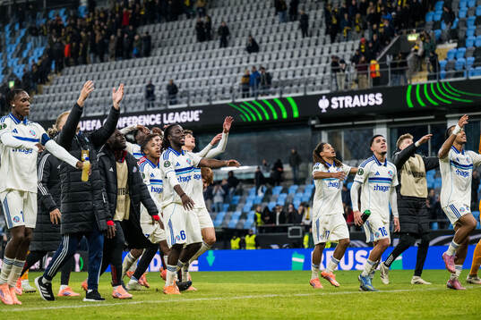 Ismael Doukoure of Strasbourg celebrates with team mates