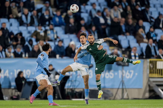 Adrian Skogmar of Malmö FF and Manolis Siopis of