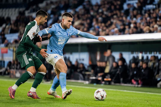 Giannis Kotsiras of Panathinaikos and Gabriel Busanello of