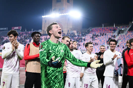 Goalkeeper Mathias Dyngeland of Brann celebrates