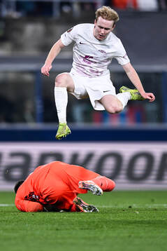 Markus Haaland of Brann and goalkeeper Lukasz Skorupski of