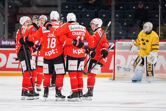 Sven Jung of Switzerland celebrate with teammates