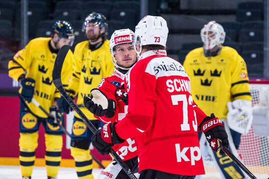 Tino Kessler and Sandro Schmid of Switzerland celebrate